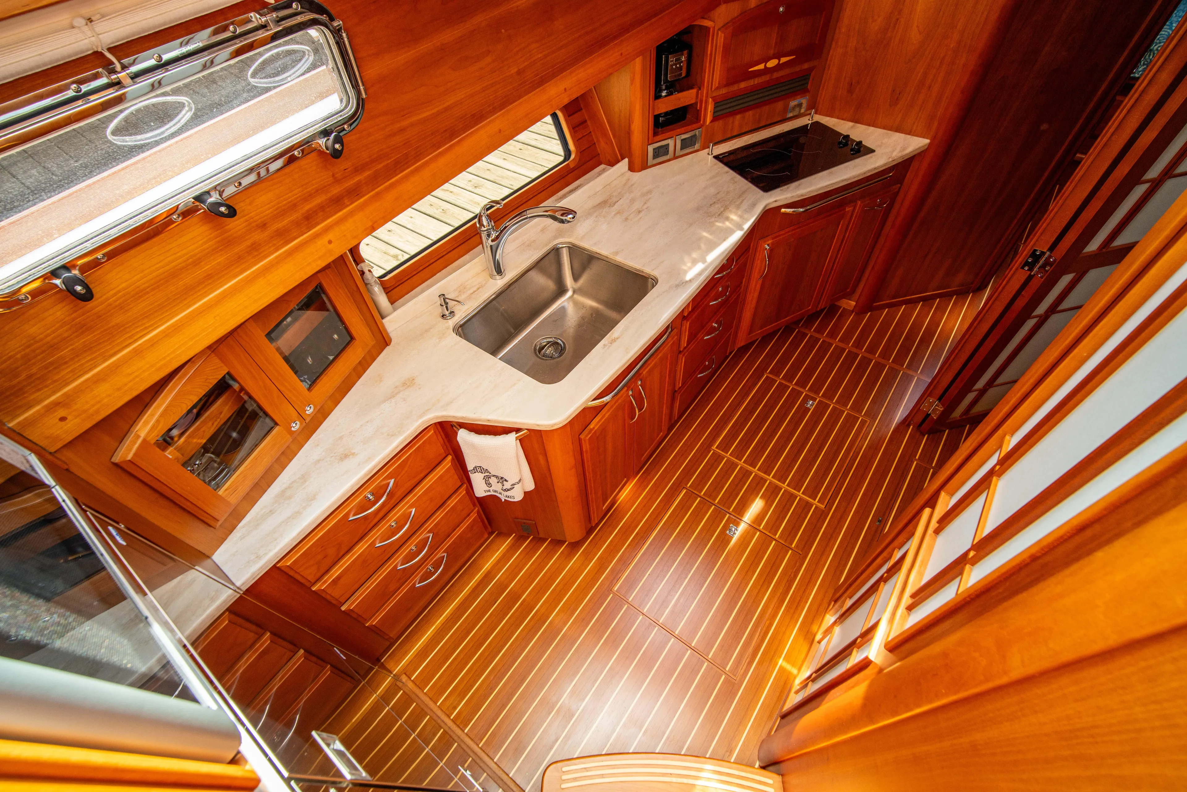  Yacht Photos Pics Luxurious 2015 Sabre 48 Salon Express yacht kitchen with wood cabinetry and modern appliances.
