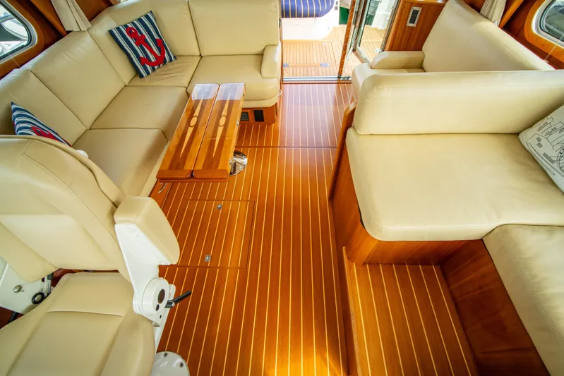  Yacht Photos Pics Interior of 2015 Sabre 48 Salon Express with beige seating and wooden flooring.