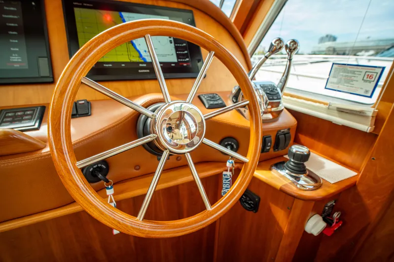  Yacht Photos Pics Steering wheel of 2015 Sabre 48 Salon Express yacht with navigation controls.
