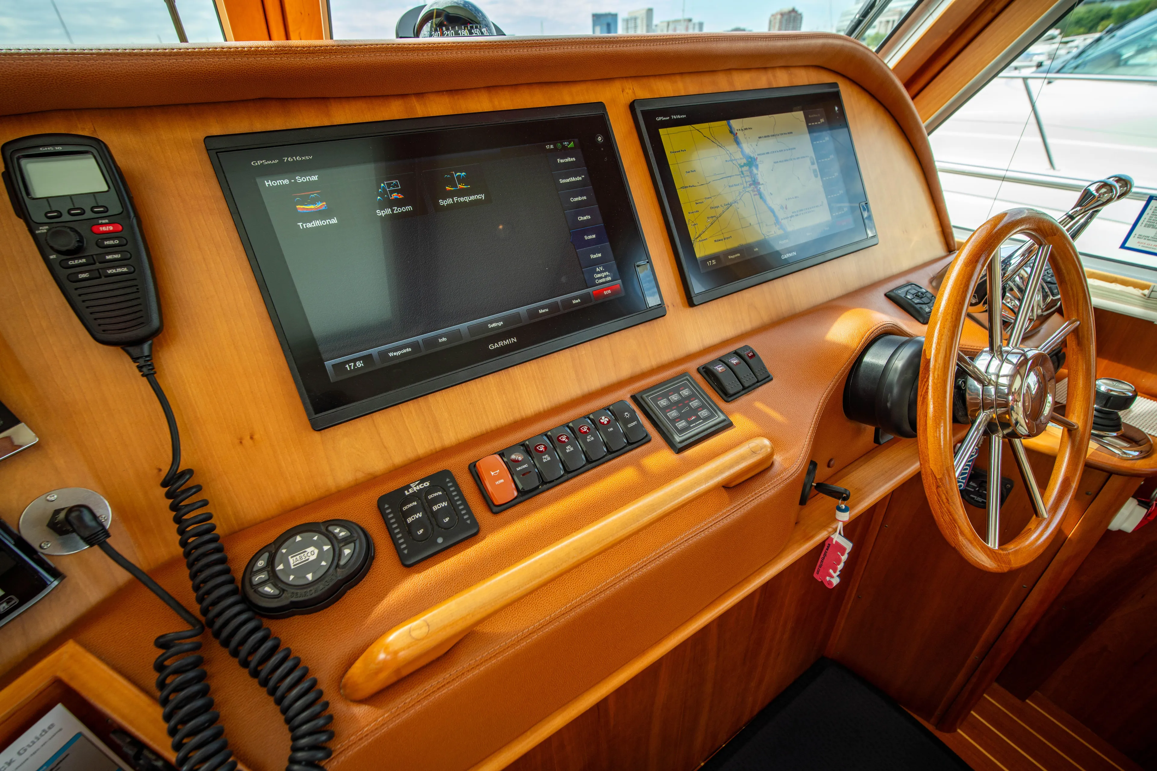  Yacht Photos Pics 2015 Sabre 48 Salon Express helm with navigation screens and controls.