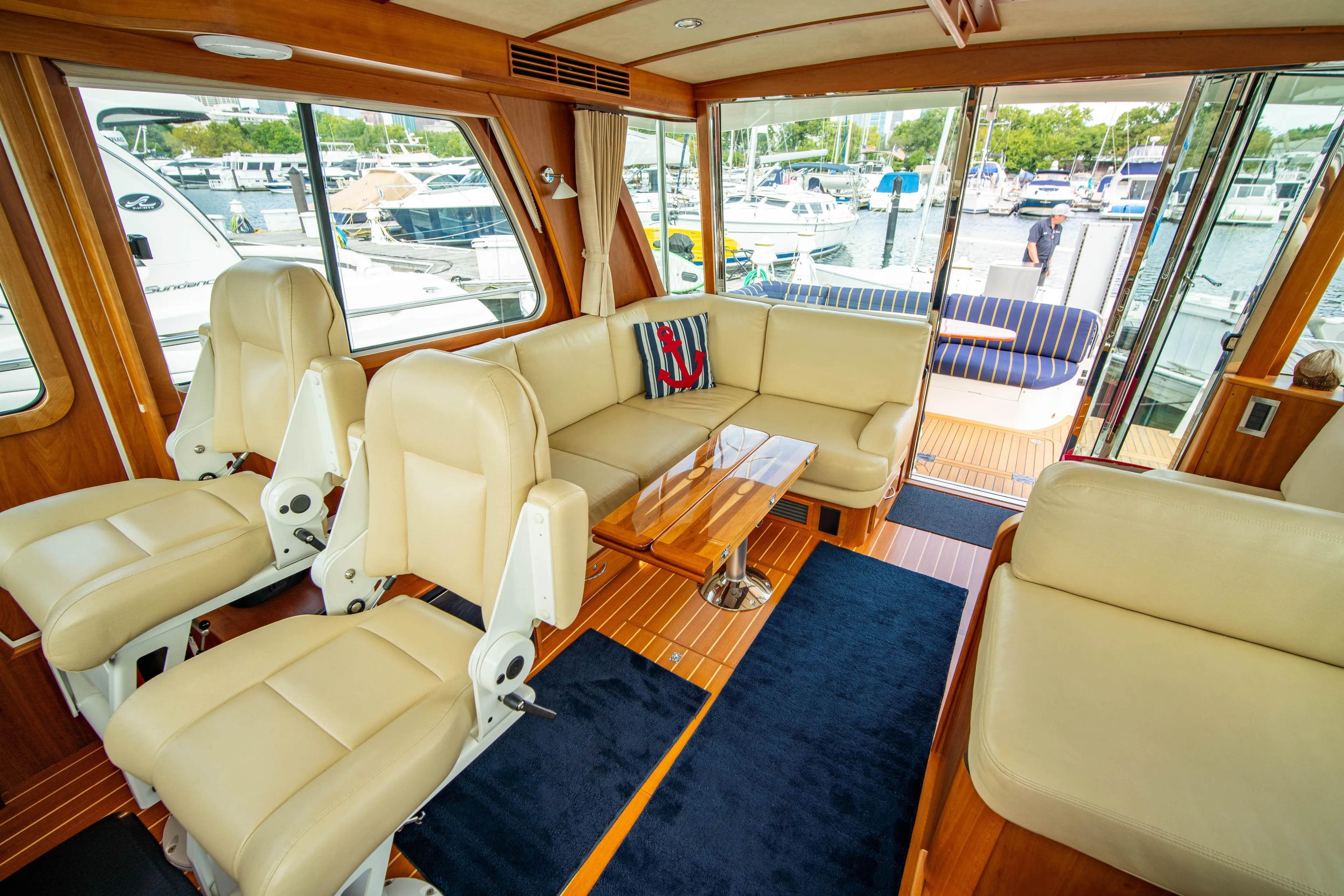  Yacht Photos Pics Luxurious interior of 2015 Sabre 48 Salon Express yacht with leather seating and wood accents.