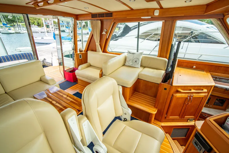  Yacht Photos Pics Interior of 2015 Sabre 48 Salon Express yacht with luxurious seating and wood finishes.