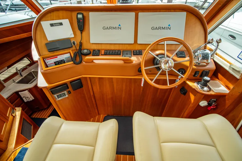  Yacht Photos Pics 2015 Sabre 48 Salon Express helm with Garmin navigation and wooden steering wheel.