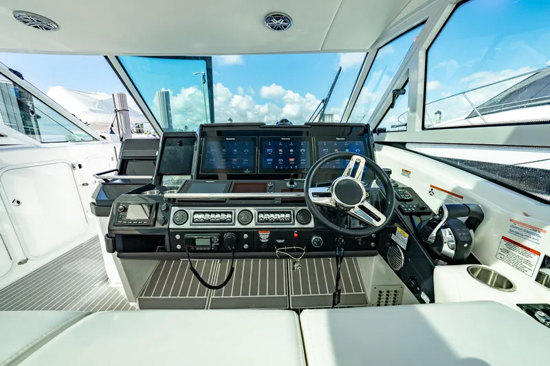 Southern Office Yacht Photos Pics 2018 Formula 430 Super Sport Crossover helm with modern navigation controls and panoramic view.