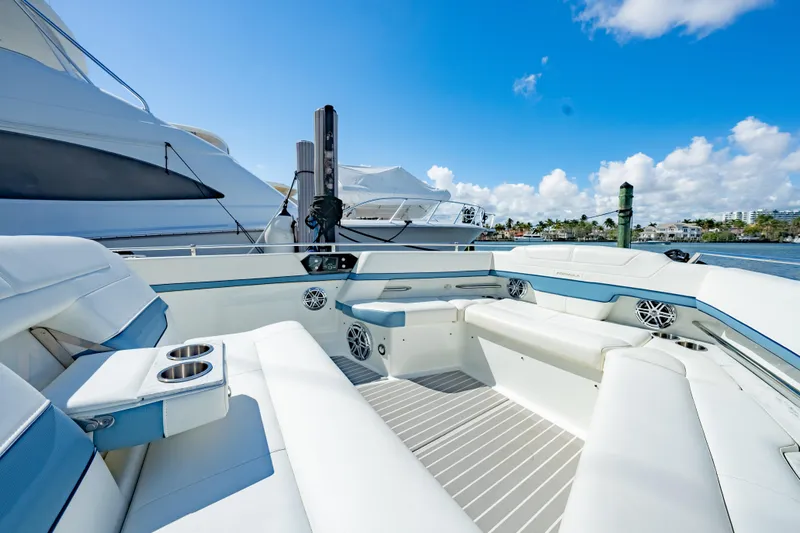 Southern Office Yacht Photos Pics 2018 Formula 430 Super Sport Crossover yacht with luxurious seating, docked under a clear blue sky.