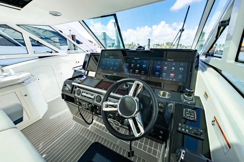 Southern Office Yacht Photos Pics 2018 Formula 430 Super Sport Crossover cockpit with modern navigation system and sleek design.
