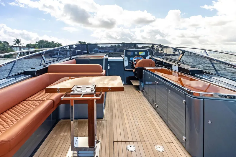 Il-viaggio Yacht Photos Pics Luxurious 2021 Riva 56 Rivale yacht interior with elegant seating and modern helm.