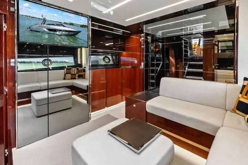 Il-viaggio Yacht Photos Pics Luxurious interior of 2021 Riva 56 Rivale yacht with modern seating and elegant design.