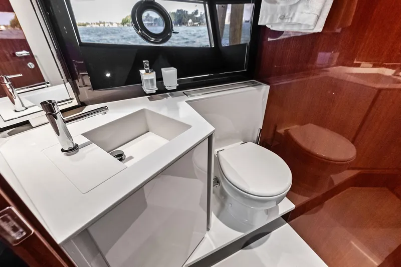 Il-viaggio Yacht Photos Pics Luxurious bathroom interior of 2021 Riva 56 Rivale yacht with modern fixtures.