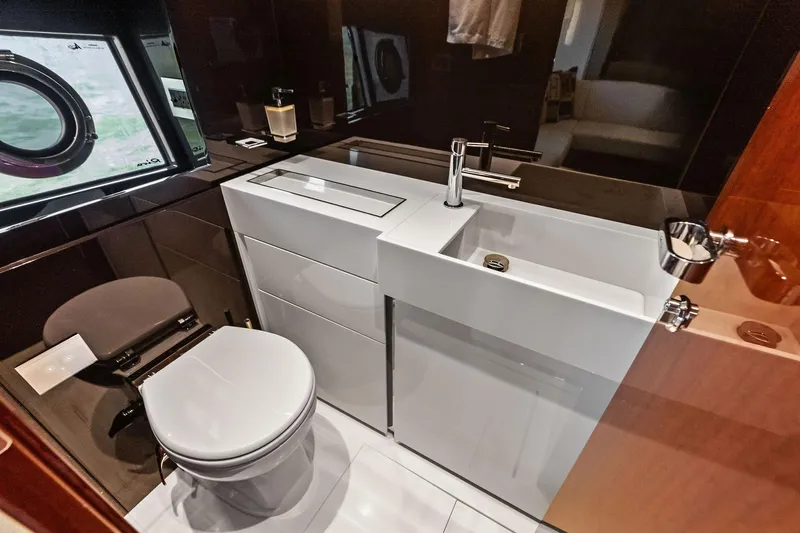 Il-viaggio Yacht Photos Pics Luxurious bathroom in 2021 Riva 56 Rivale yacht with modern fixtures and sleek design.