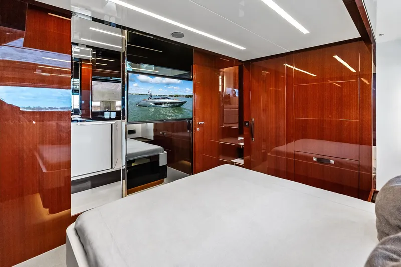 Il-viaggio Yacht Photos Pics Luxurious interior of 2021 Riva 56 Rivale yacht with sleek wood finishes and modern design.