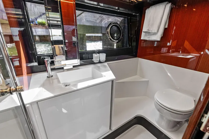 Il-viaggio Yacht Photos Pics Luxurious bathroom interior of 2021 Riva 56 Rivale yacht with modern fixtures.