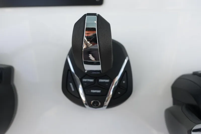  Yacht Photos Pics 2022 Cape Horn 34 XS boat control lever with buttons on a sleek console.