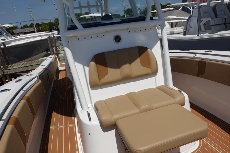  Yacht Photos Pics 2022 Cape Horn 34 XS boat interior with tan seating and white console.