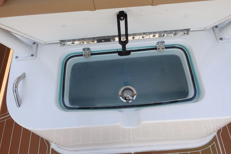  Yacht Photos Pics Livewell on 2022 Cape Horn 34 XS boat, featuring a secure latch and clear lid.