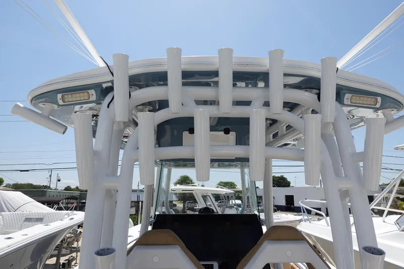  Yacht Photos Pics 2022 Cape Horn 34 XS boat with rod holders and T-top under clear sky.