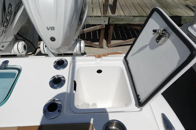  Yacht Photos Pics 2022 Cape Horn 34 XS boat with open storage compartment and engine details.