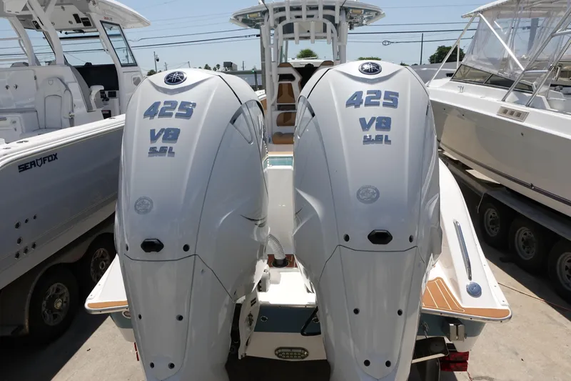  Yacht Photos Pics 2022 Cape Horn 34 XS with twin 425 V8 outboard engines, docked in a marina.