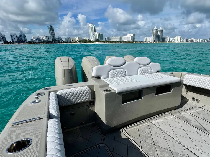 Reel Cool Yacht Photos Pics Luxurious HCB Lujo boat 2024 with urban skyline backdrop.