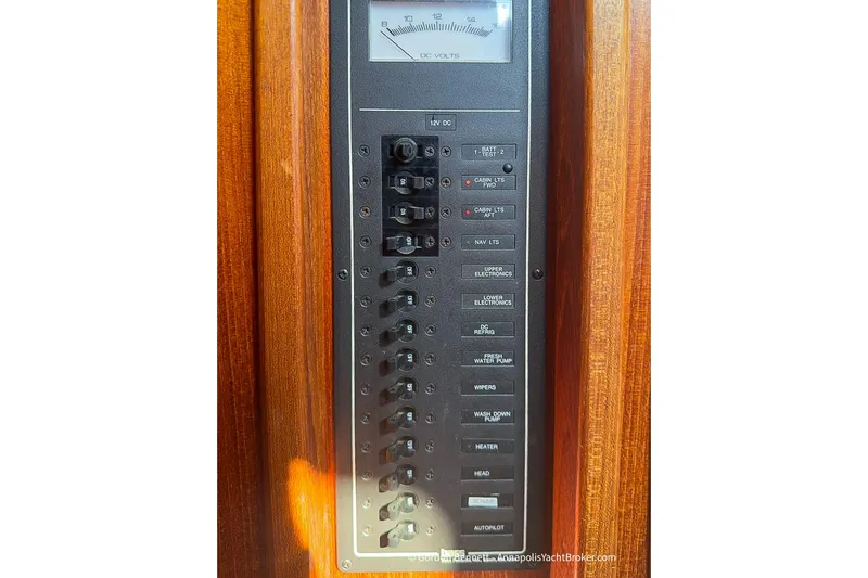 Dee Gee Yacht Photos Pics Electrical panel on a 1999 Nordic Tug 37 boat, featuring various switches and a voltmeter.