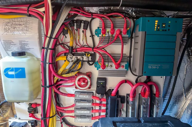 Dee Gee Yacht Photos Pics Electrical system of a 1999 Nordic Tug 37, featuring wiring and a battery charger.