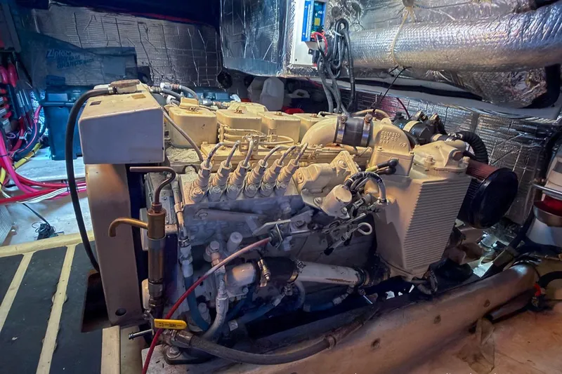 Dee Gee Yacht Photos Pics Engine room of a 1999 Nordic Tug 37, showcasing detailed mechanical components.