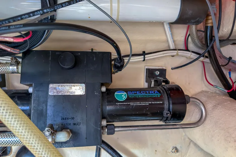 Dee Gee Yacht Photos Pics Engine room of 1999 Nordic Tug 37 featuring Spectra watermaker system.