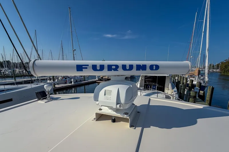 Dee Gee Yacht Photos Pics Radar equipment on 1999 Nordic Tug 37 boat docked at marina.