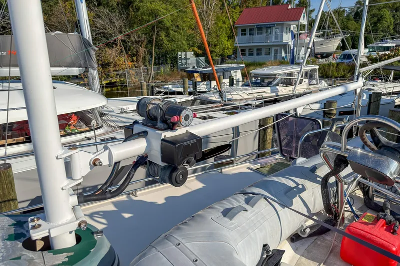 Dee Gee Yacht Photos Pics 1999 Nordic Tug 37 at marina with equipment and nearby boats.