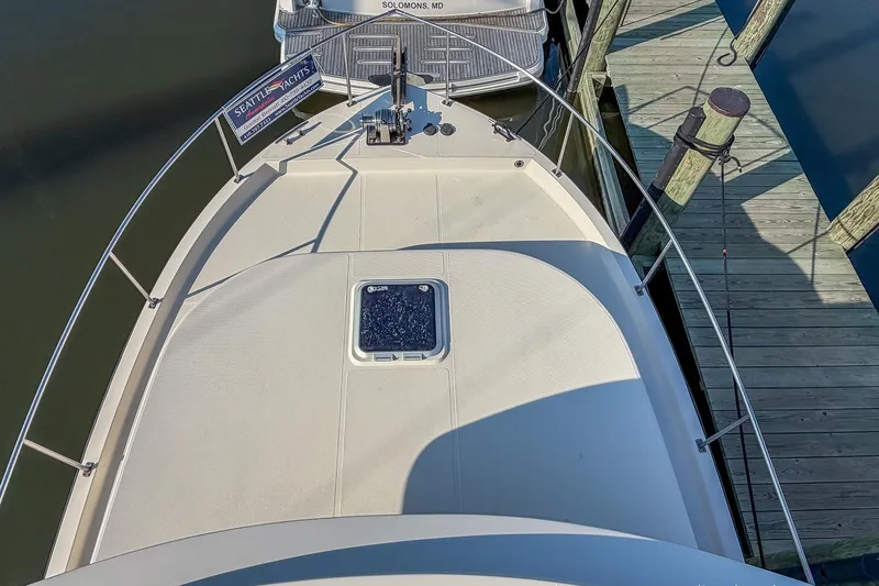 Dee Gee Yacht Photos Pics Bow view of 1999 Nordic Tug 37 docked at marina.