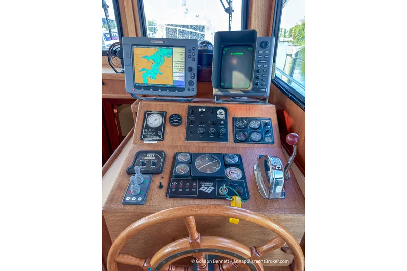 Dee Gee Yacht Photos Pics Control panel of a 1999 Nordic Tug 37 with navigation and monitoring instruments.