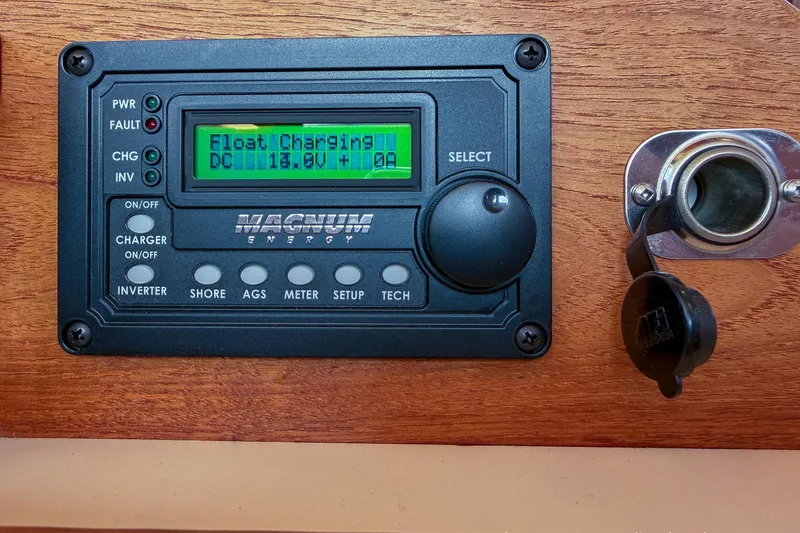 Dee Gee Yacht Photos Pics Magnum Energy control panel on 1999 Nordic Tug 37, displaying float charging status.
