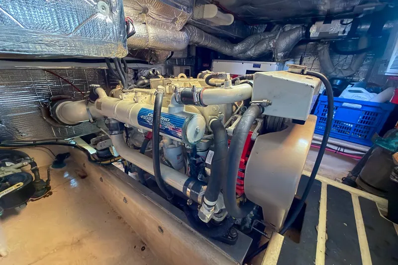 Dee Gee Yacht Photos Pics Engine room of a 1999 Nordic Tug 37, showcasing detailed mechanical components.