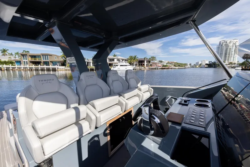 First Class Yacht Photos Pics Tesoro T38 Cruiser 2022 yacht interior with luxurious seating and modern controls.