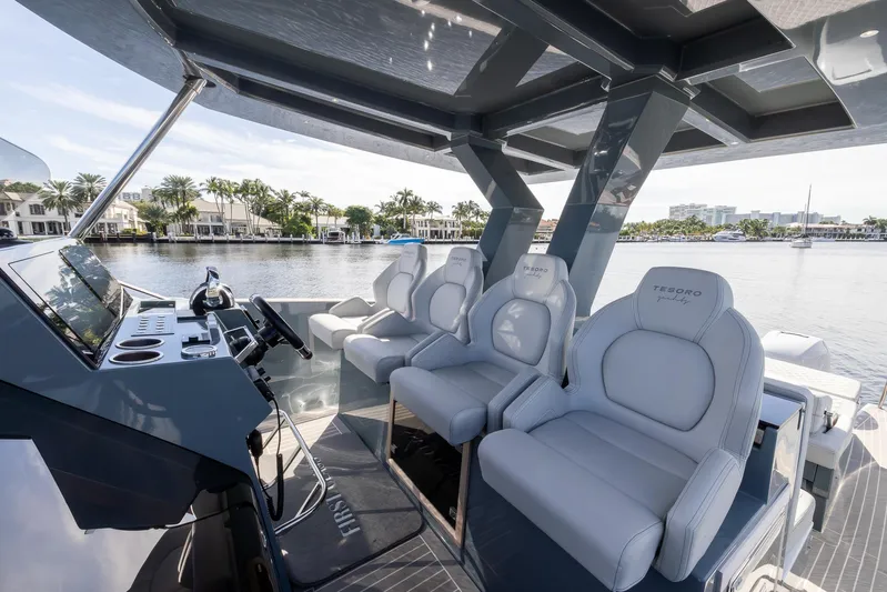 First Class Yacht Photos Pics Luxurious 2022 Tesoro T38 Cruiser interior with plush seating and modern design.