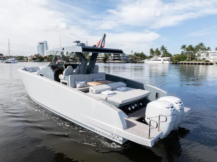 First Class Yacht Photos Pics 2022 Tesoro T38 Cruiser on calm water, showcasing sleek design and modern features.