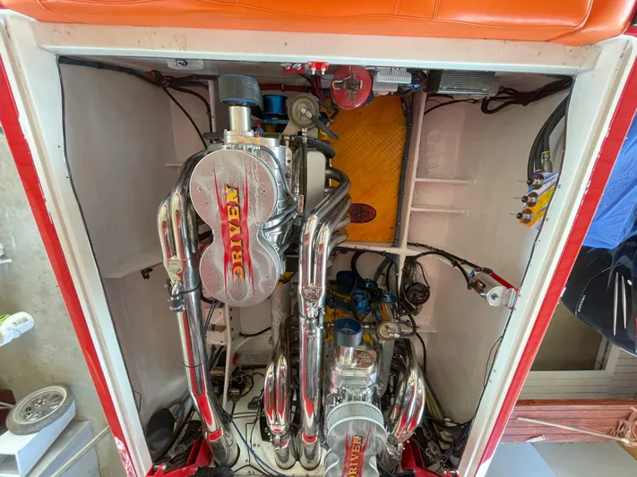 Driven Yacht Photos Pics Engine compartment of a 2002 Cigarette ROUGH RIDER boat with chrome components.