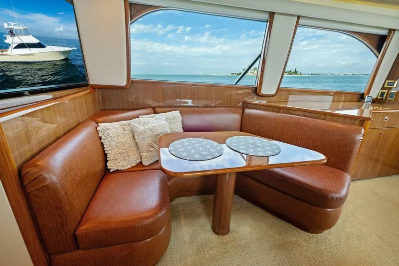 Summer Salt Yacht Photos Pics Luxurious interior of 2006 Viking 56 Convertible yacht with plush seating and ocean view.
