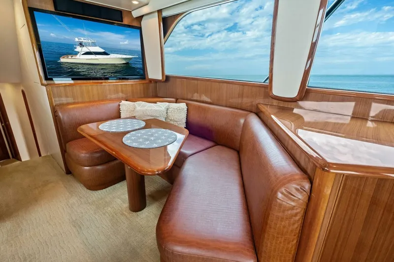 Summer Salt Yacht Photos Pics Luxurious interior of 2006 Viking 56 Convertible yacht with leather seating and ocean view.