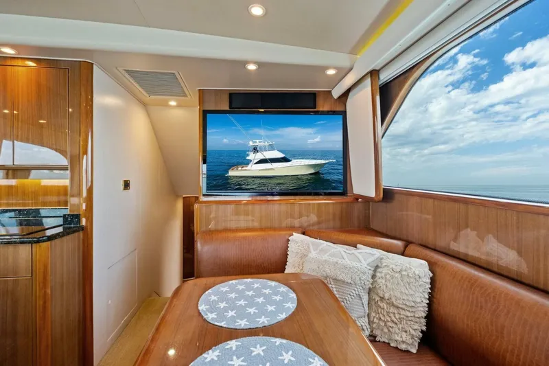 Summer Salt Yacht Photos Pics Luxurious interior of 2006 Viking 56 Convertible yacht with ocean view and TV display.