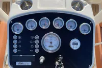 Control panel of a 2022 GS 27 boat with gauges and switches.