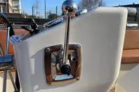 Boat control lever on GS 27 model, 2022, with chrome finish and sunny background.