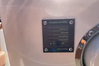 Control panel with status indicators for inverter, overload, low battery, and temperature on GS 27, 2022.