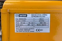 Yellow Vetus marine diesel engine label with specifications, including power, weight, and manufacturing date.