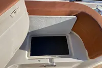 Boat seating with storage compartment, GS 27 model, 2022, featuring brown and beige upholstery.