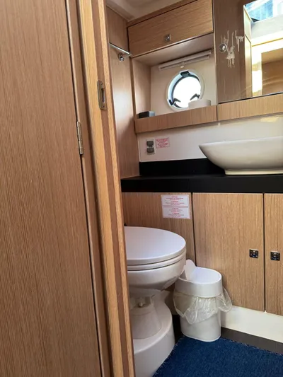 Lady V Yacht Photos Pics 2024 Bavaria Virtess 420 Fly bathroom with modern fixtures and wood cabinetry.