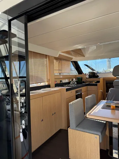 Lady V Yacht Photos Pics 2024 Bavaria Virtess 420 Fly yacht interior with modern kitchen and dining area.