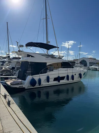 Lady V Yacht Photos Pics 2024 Bavaria Virtess 420 Fly yacht docked in a sunny marina.
