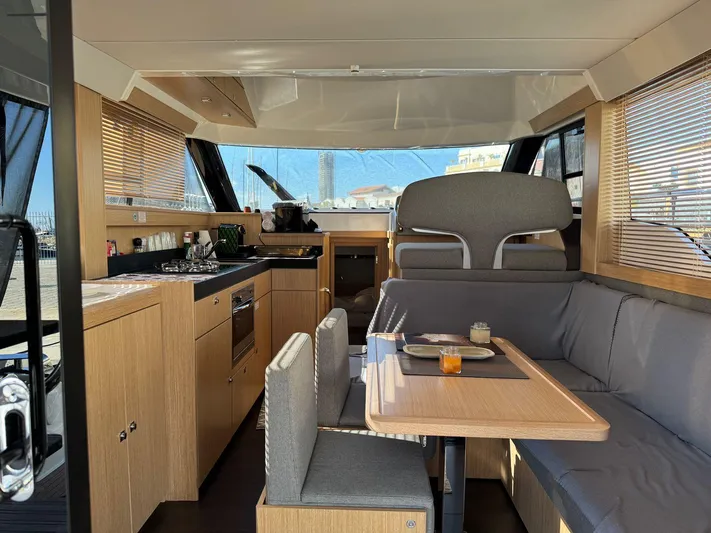 Lady V Yacht Photos Pics 2024 Bavaria Virtess 420 Fly yacht interior with modern kitchen and dining area.