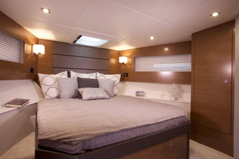  Yacht Photos Pics Luxurious bedroom interior of 2026 Cruisers Yachts 42 Cantius with modern design and cozy ambiance.